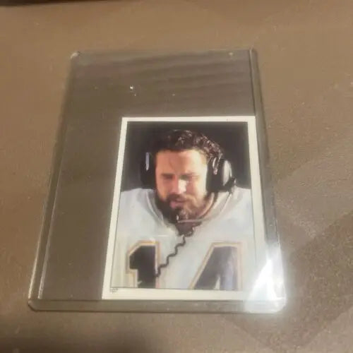 Football card of Dan Fouts in headset from Topps Football Stickers, San Diego Chargers