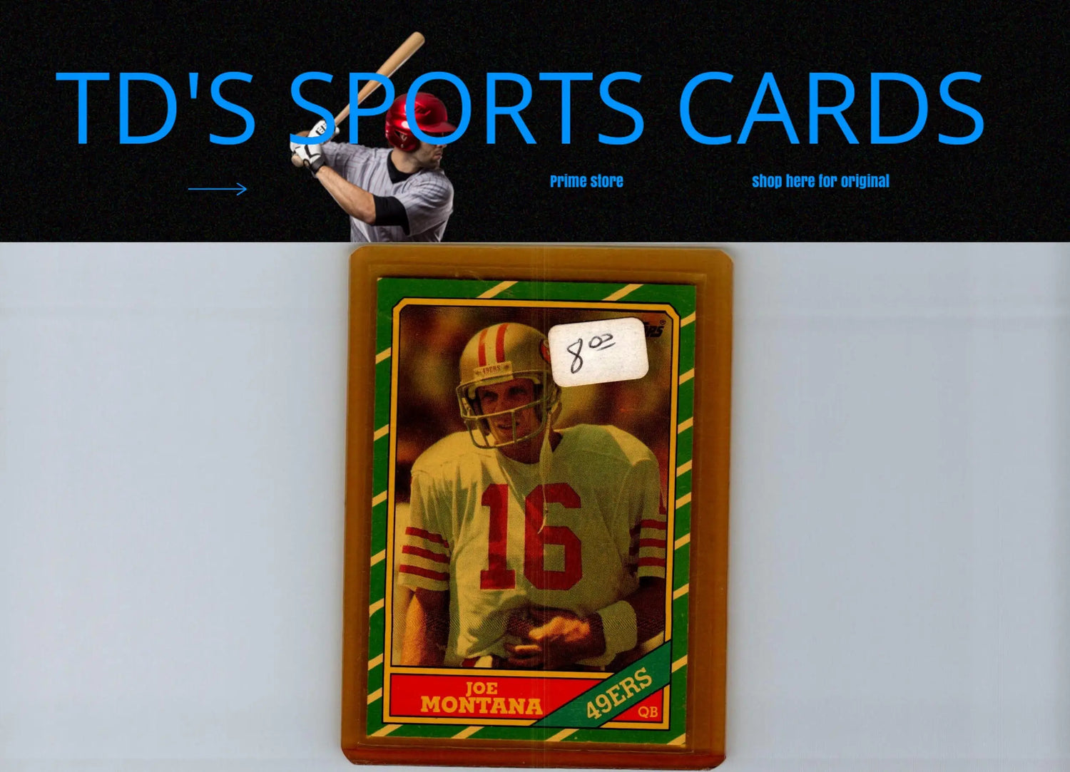 Framed Joe Montana 49ers football trading card with $8.00 price tag from 1986 Topps