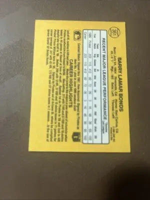 Yellow Dunruss Baseball card featuring Barry Bonds with player stats and career highlights