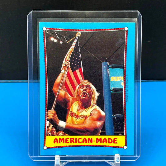 Hulk Hogan trading card showing him with an American flag from Topps WWF series