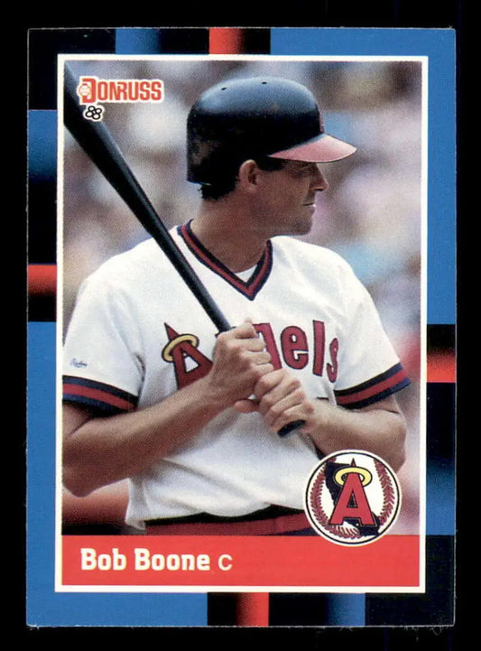 Baseball card of Bob Boone from the California Angels in a white uniform holding a bat