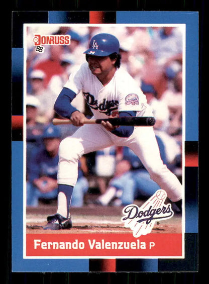 1988 Donruss Fernando Valenzuela baseball card showing Los Angeles Dodgers pitcher bunting