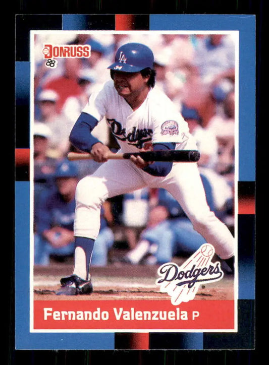 1988 Donruss Fernando Valenzuela baseball card showing Los Angeles Dodgers pitcher bunting