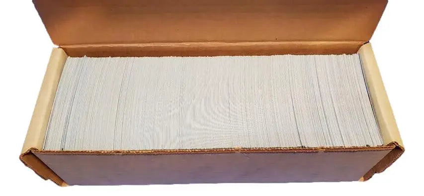 Box filled with stacked white cards showcasing the Donruss Hand Collected Set