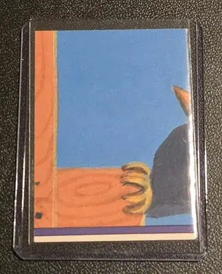 Garbage Pail Kids collectible card featuring animal paw grasping wooden frame in sleeve