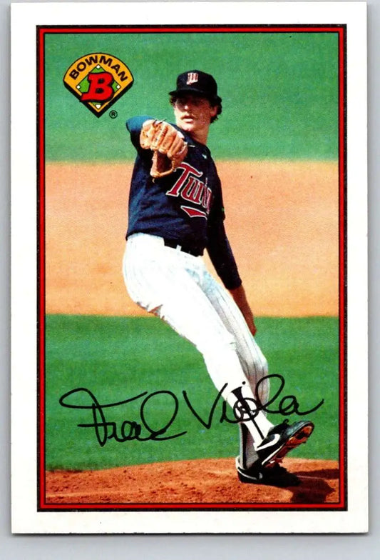 Baseball player Frank Viola in navy Minnesota Twins uniform mid-pitch on mound