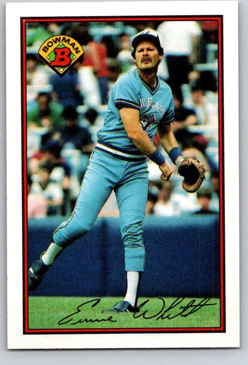 Baseball player in light blue uniform pitching for Toronto Blue Jays Ernie Whitt
