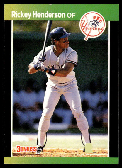 Rickey Henderson New York Yankees baseball card featuring player at bat in white uniform