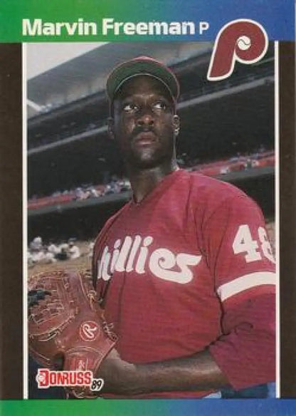 Baseball player in red Phillies jersey representing Marvin Freeman baseball card