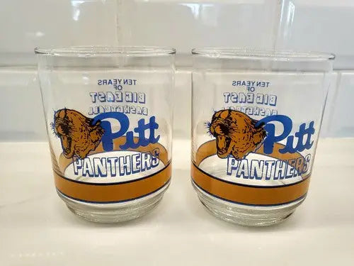 Two Pitt Panthers glasses celebrating Big East basketball history, Pittsburg Ten Years cup