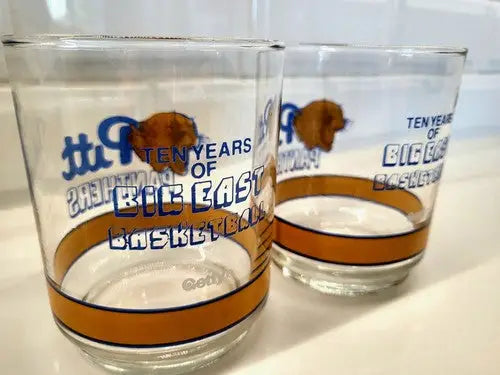 Two Pitt Panthers Big East basketball glasses displayed in the 1989 Pittsburg Getty Cup