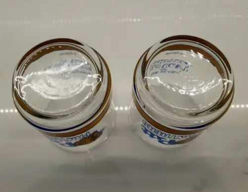 Two clear glass beer mugs featuring Pitts Panthers and Big East basketball logo