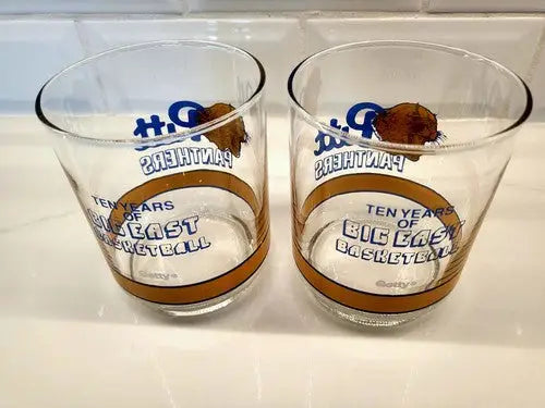 Two Pitt Panthers basketball glasses celebrating Big East basketball history