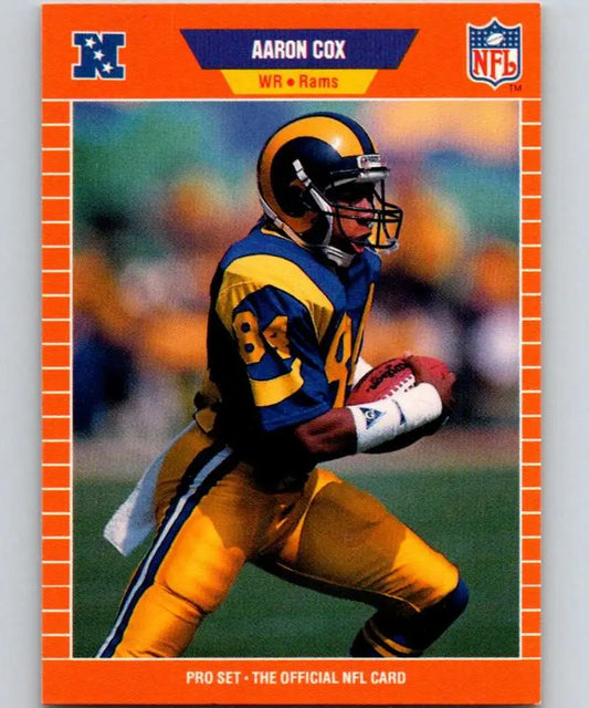 NFL trading card of Aaron Cox running in Los Angeles Rams yellow and blue uniform
