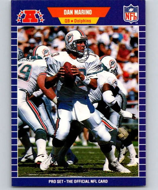 Miami Dolphins football card of Dan Marino in white uniform dropping back to pass