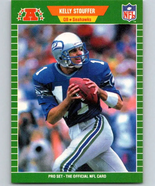 NFL trading card of Kelly Stouffer in Seattle Seahawks blue uniform holding a football