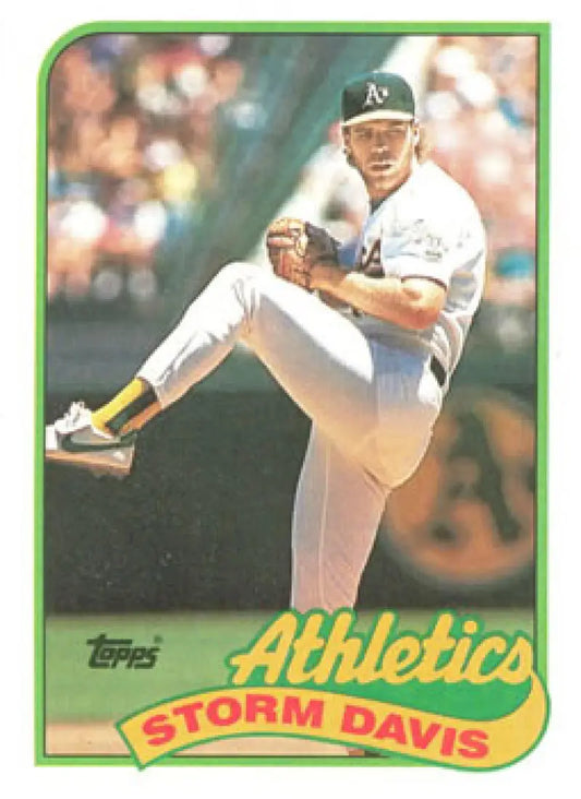 Baseball card of Storm Davis pitching for Oakland Athletics in mid-delivery motion