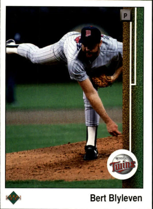 Bert Blyleven pitching in Minnesota Twins pinstripe uniform on the mound