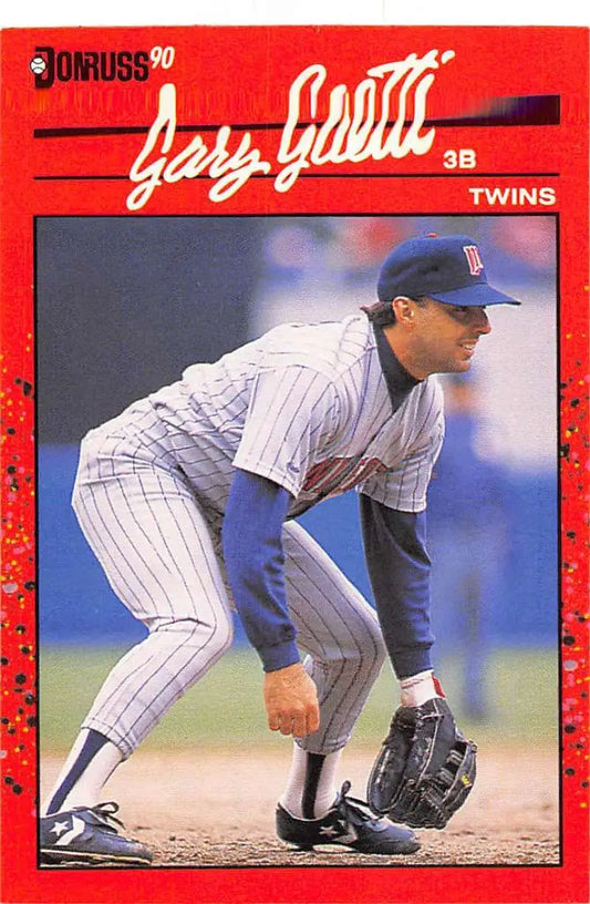 Red 1990 Donruss baseball card of Gary Gaetti in fielding stance for trading cards collection