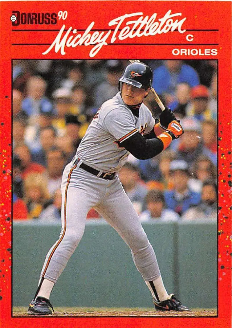 Red 1990 Donruss baseball card of Mickey Tettleton from the Baltimore Orioles