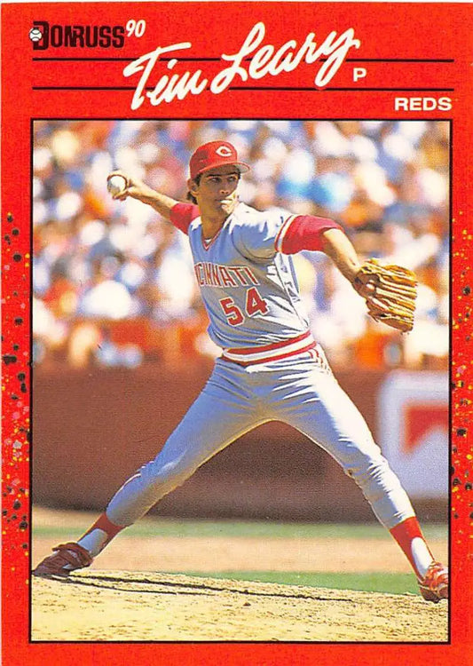 Red 1990 Donruss Tim Leary baseball card showcasing Cincinnati Reds pitcher in delivery