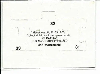 White jigsaw puzzle piece with cutouts for connection from Donruss Carl Yastrzemski puzzle