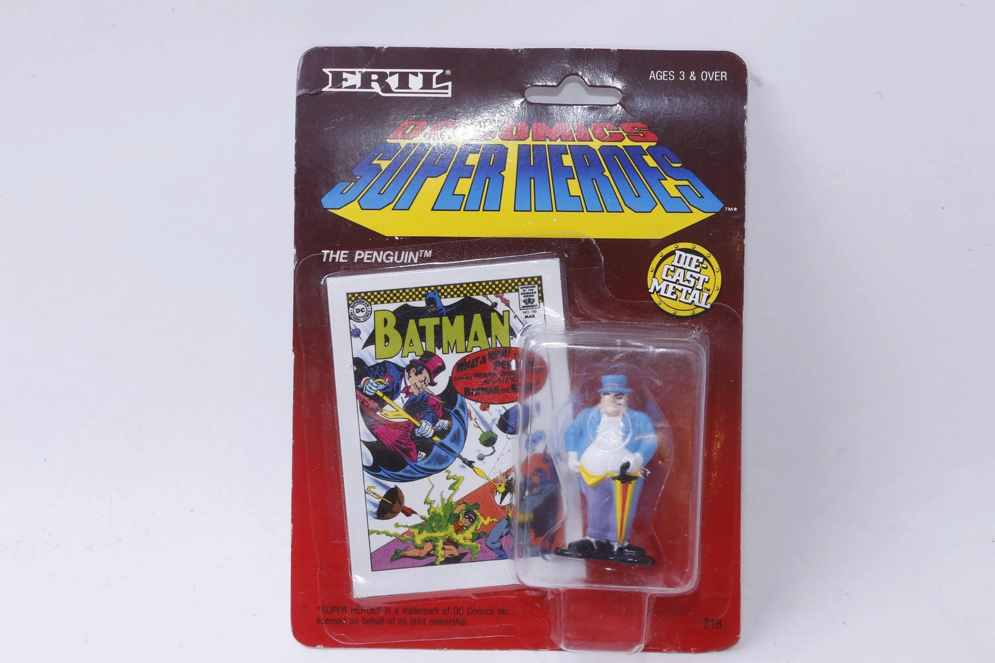 Vintage ERTL die-cast Penguin figure sealed in original packaging from 1990