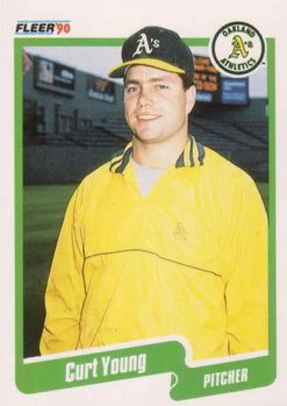 1990 Fleer Curt Young Baseball Card featuring Oakland Athletics pitcher in yellow jacket