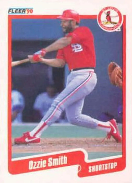 Ozzie Smith mid-swing on a St. Louis Cardinals baseball card from 1990 Fleer