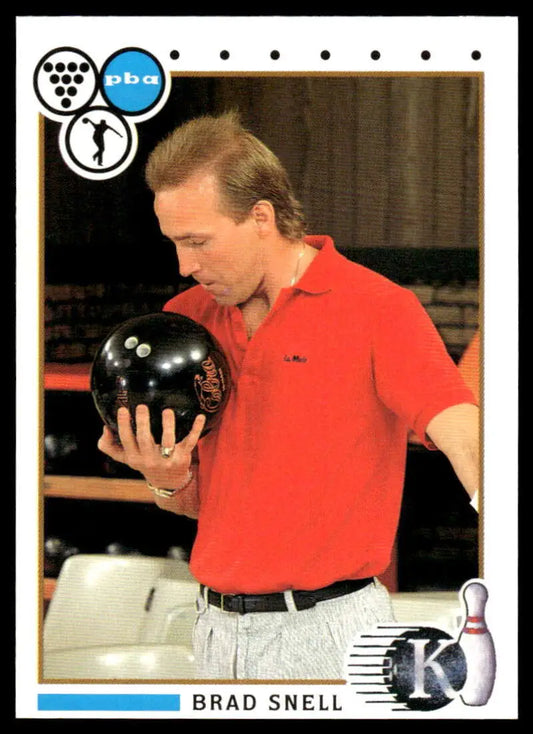Brad Snell in red polo shirt with black bowling ball for PBA Bowling Card display