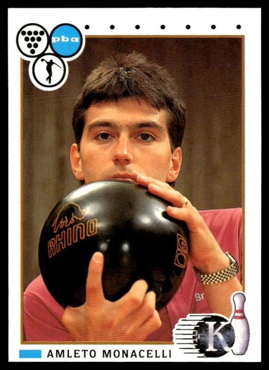 Professional bowler Amleto Monacelli holding a black bowling ball for PBA Bowling Card