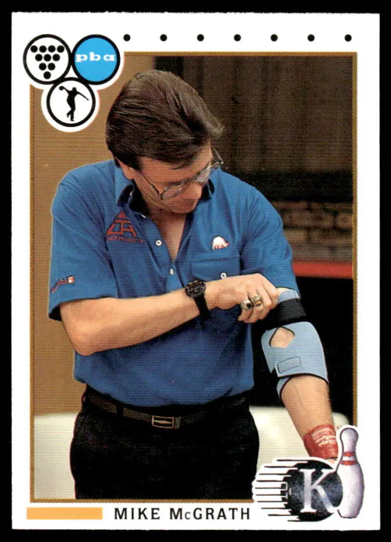 Professional bowler Art Trask in blue polo checking watch on PBA bowling card