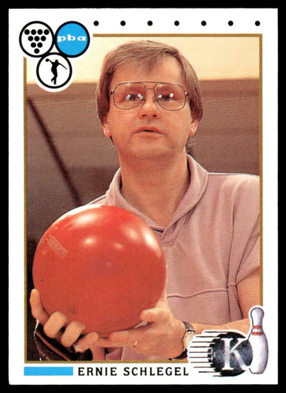 Bright red bowling ball held in front of a light shirt for Ernie Schlegel PBA Bowling Card