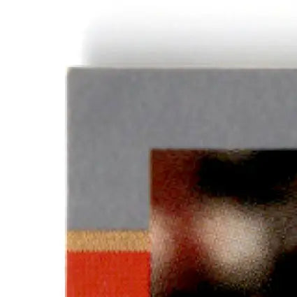 Corner of multi-colored Pro Set Jerry Rice Super Bowl MVP card with gray, tan, and red stripes