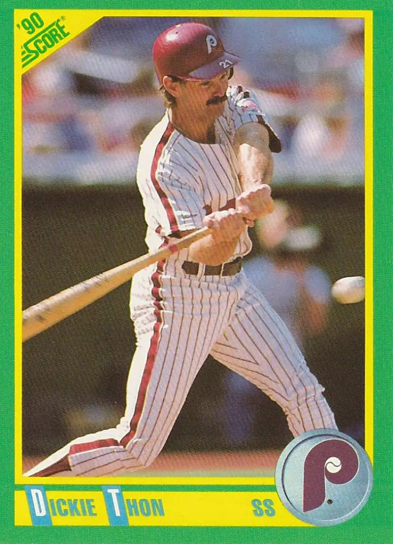 Baseball player in Philadelphia Phillies uniform swinging bat on Dickie Thon baseball card