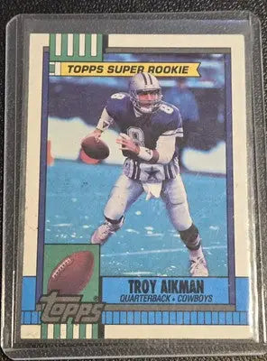 Troy Aikman football card 1990 Topps rookie card featuring Troy Aikman on back