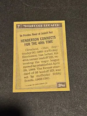 Back of 1990 Topps Rickey Henderson baseball card showing stats and card details