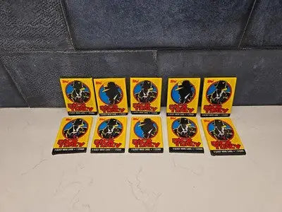 Ten unopened Topps Dick Tracy trading card wax packs for collectible sports trading cards