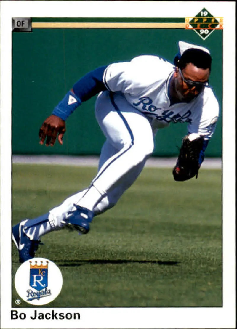 Kansas City Royals player dives for a catch in home white uniform on baseball card