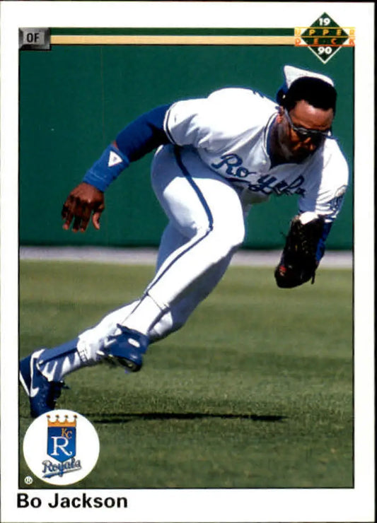 Kansas City Royals player dives for a catch in home white uniform on baseball card