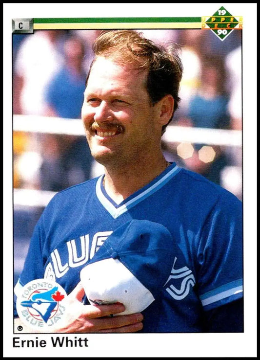 Smiling Ernie Whitt in Toronto Blue Jays uniform on 1990 Upper Deck baseball card