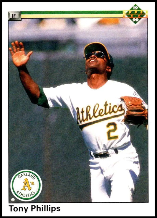 Tony Phillips catching a baseball in white uniform on 1990 Upper Deck Oakland Athletics card