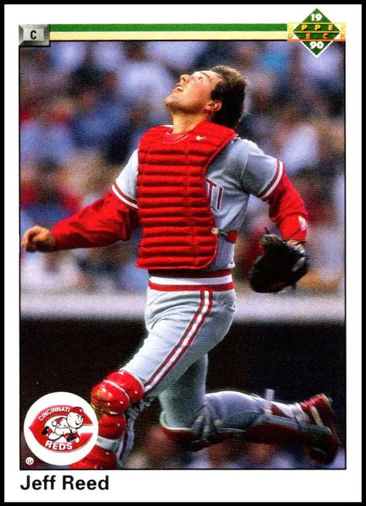 Jeff Reed tracking a pop-up in Cincinnati Reds uniform on 1990 Upper Deck baseball card