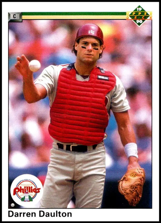 Darren Daulton in Phillies uniform ready to throw on 1990 Upper Deck baseball card