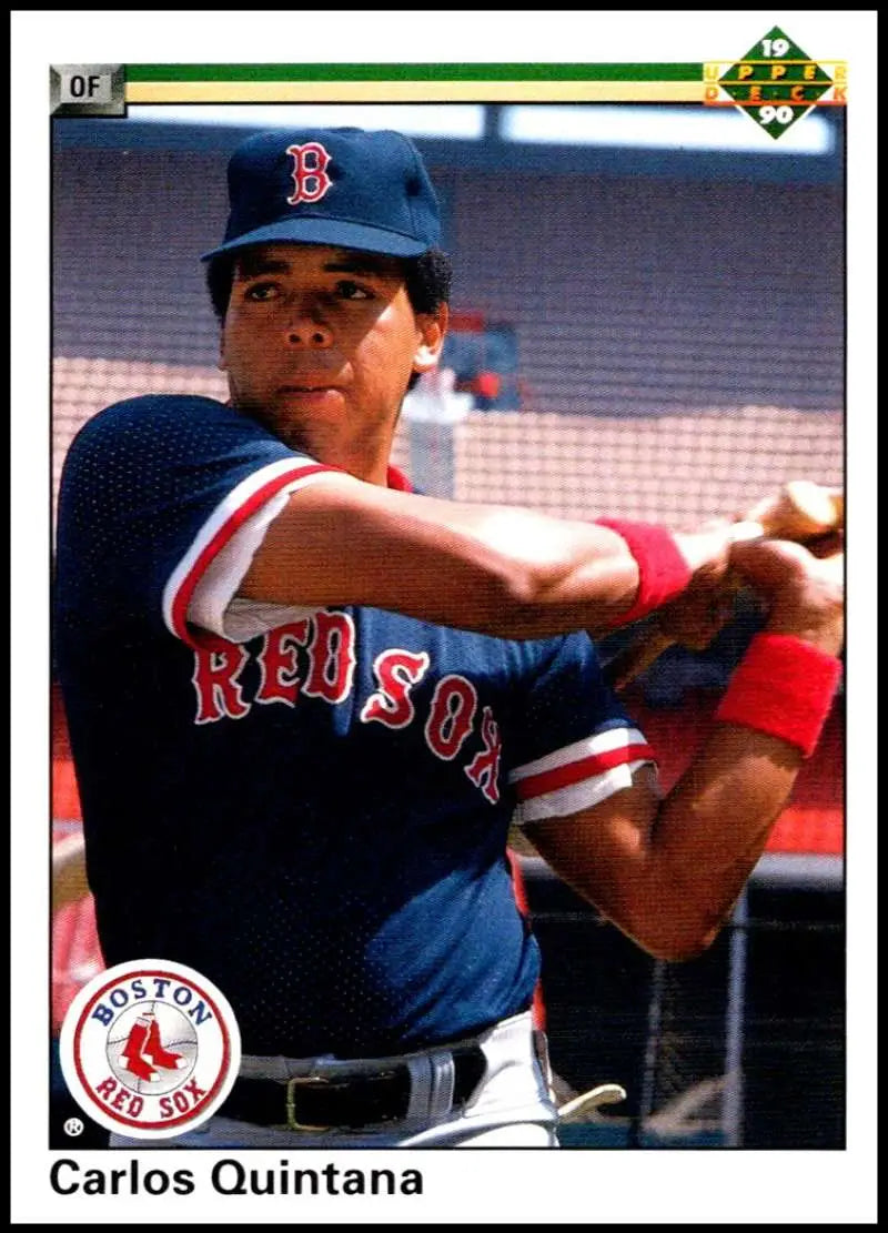 Baseball player Carlos Quintana in Boston Red Sox uniform taking batting stance