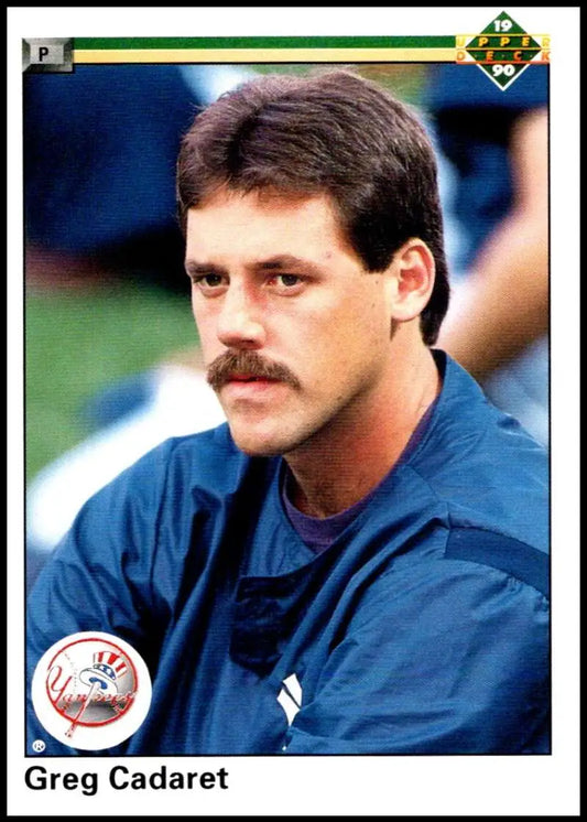 Greg Cadaret in a blue Yankees jacket with a dark mustache on a baseball card