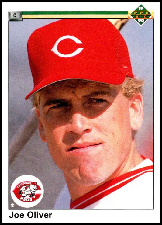 Baseball player Joe Oliver in a red Cincinnati Reds cap on 1990 baseball card