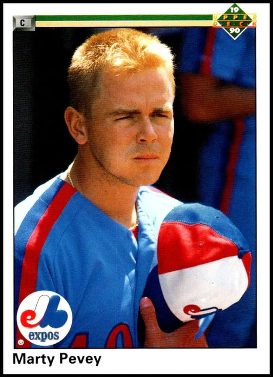 Marty Pevey in Expos uniform holds red and white cap, featured on Upper Deck rookie card