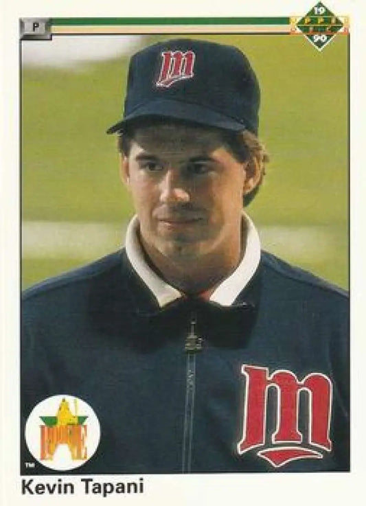 Baseball player in Minnesota Twins jacket and cap featuring Kevin Tapani Upper Deck card