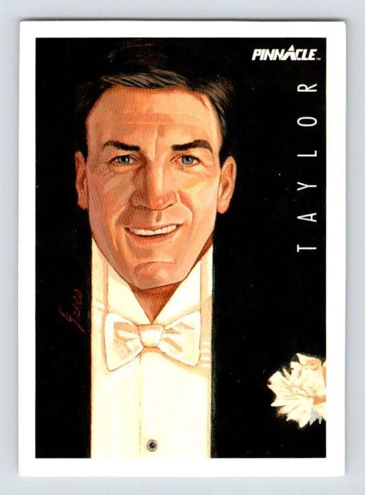 Smiling man in a tuxedo representing Dave Taylor of the Los Angeles Kings